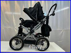 4 wheel push chair with free carry cot, rain cover and baby bag in black